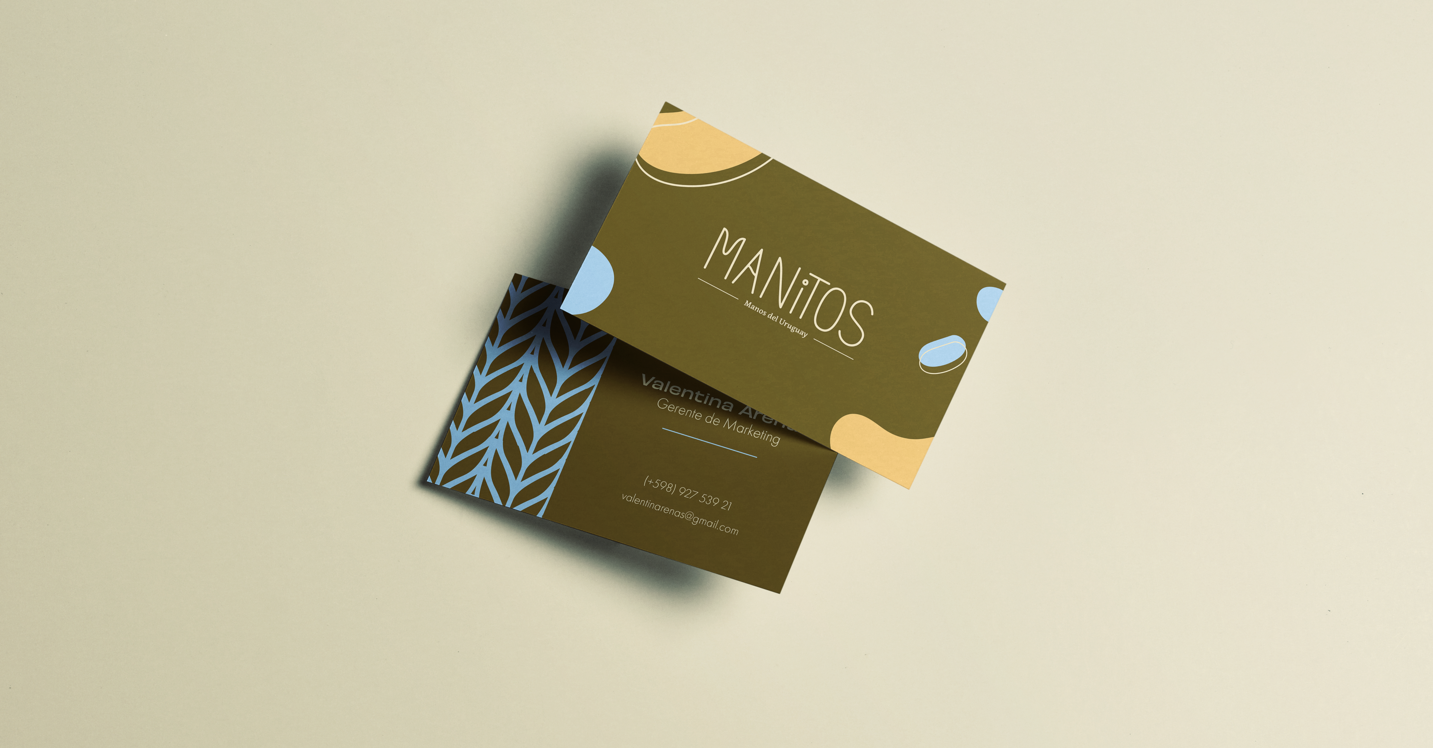 Manitos brand identity card design with playful graphic elements